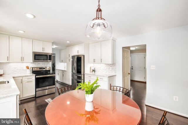 5580 Ann Peake Dr, Fairfax, VA 22032 - dining room with recessed lighting, baseboards, and dark wood-style floors