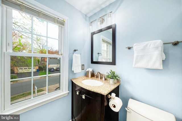 5580 Ann Peake Dr, Fairfax, VA 22032 - bathroom featuring toilet, a healthy amount of sunlight, and vanity