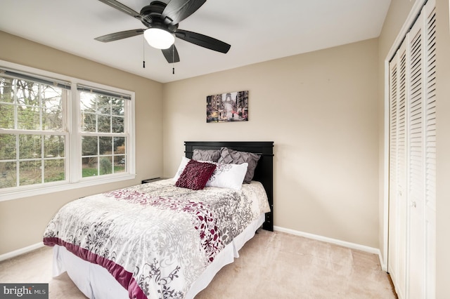 5580 Ann Peake Dr, Fairfax, VA 22032 - bedroom featuring a closet, baseboards, ceiling fan, and light colored carpet