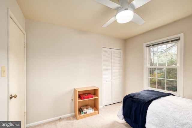 5580 Ann Peake Dr, Fairfax, VA 22032 - bedroom featuring baseboards, light carpet, a ceiling fan, and a closet