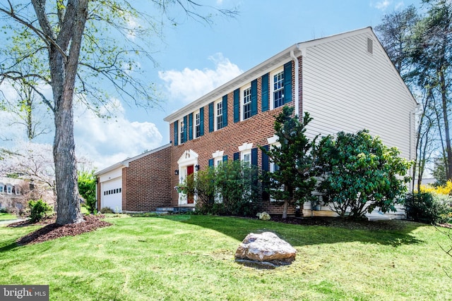 5580 Ann Peake Dr, Fairfax, VA 22032 - colonial inspired home with an attached garage, brick siding, and a front yard
