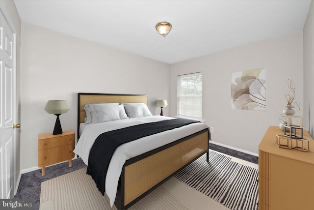 bedroom featuring baseboards and carpet floors