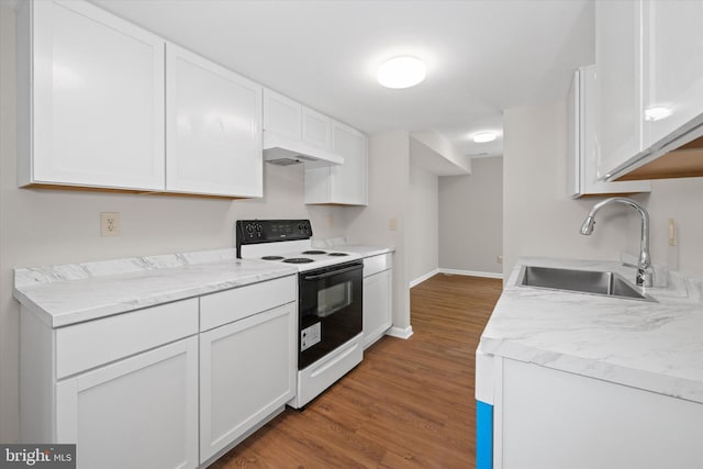 kitchen with white cabinets, a sink, electric range, wood finished floors, and light countertops