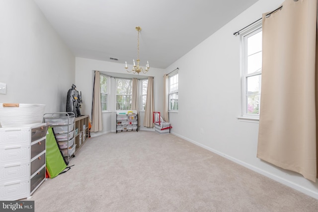 playroom with baseboards, visible vents, light colored carpet, and a notable chandelier