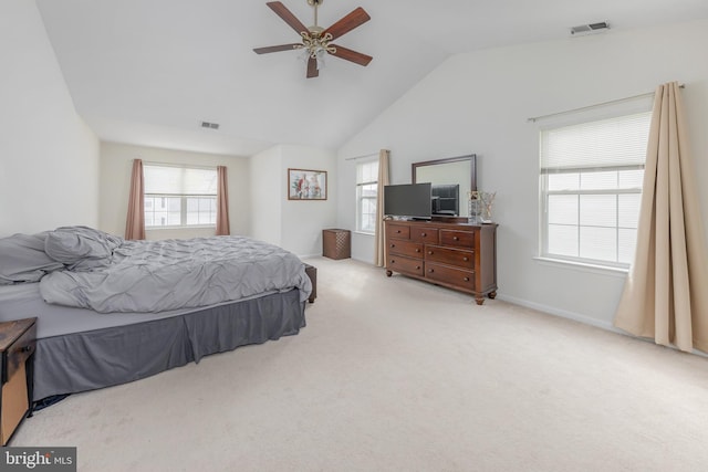 bedroom with visible vents, light carpet, multiple windows, and lofted ceiling