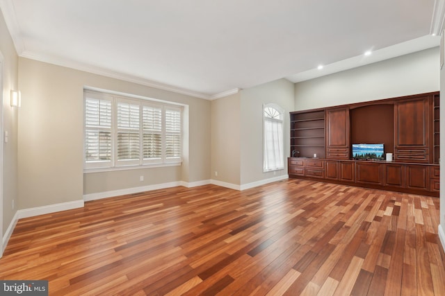 unfurnished living room with light wood-style flooring, baseboards, recessed lighting, and ornamental molding