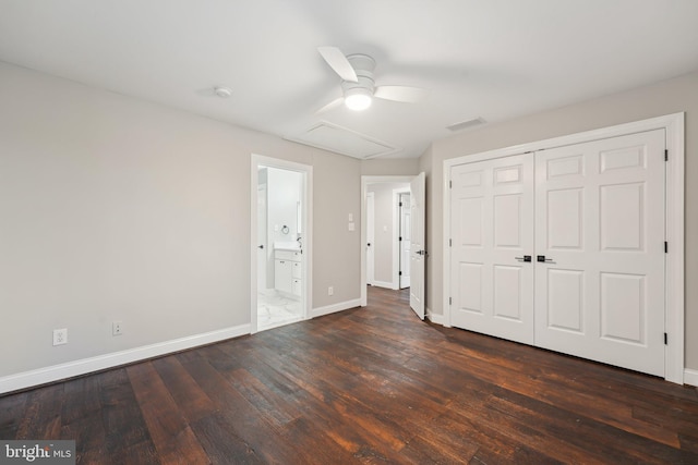 unfurnished bedroom with a closet, ceiling fan, baseboards, dark wood-type flooring, and visible vents