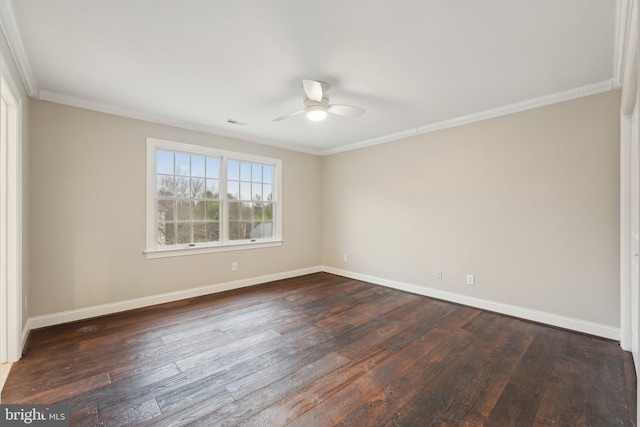 empty room with dark wood-style flooring, ornamental molding, baseboards, and ceiling fan