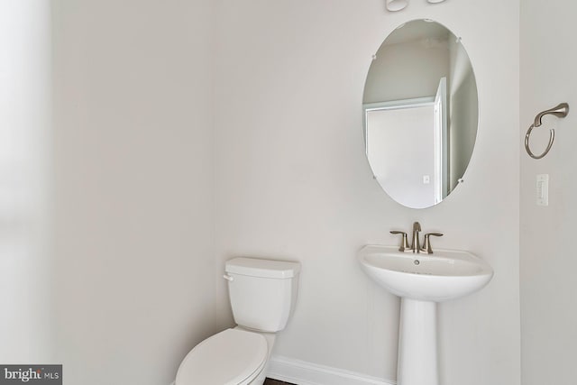 4507 Shakespeare Cir, White Plains, MD 20695 - bathroom featuring a sink, baseboards, and toilet