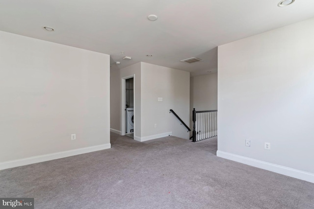 4507 Shakespeare Cir, White Plains, MD 20695 - spare room featuring washer / dryer, baseboards, carpet, and visible vents
