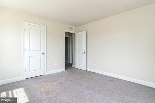 4507 Shakespeare Cir, White Plains, MD 20695 - unfurnished bedroom featuring baseboards, carpet flooring, and visible vents
