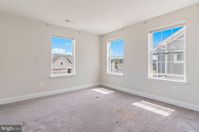 4507 Shakespeare Cir, White Plains, MD 20695 - unfurnished room with a healthy amount of sunlight, baseboards, carpet, and visible vents