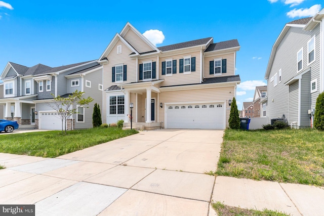 4507 Shakespeare Cir, White Plains, MD 20695 - traditional-style house with concrete driveway, an attached garage, a residential view, and a front lawn