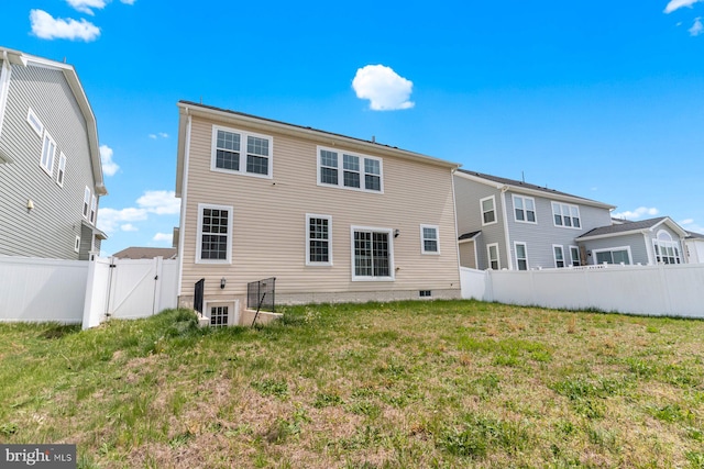 4507 Shakespeare Cir, White Plains, MD 20695 - rear view of house with a lawn, a gate, and a fenced backyard