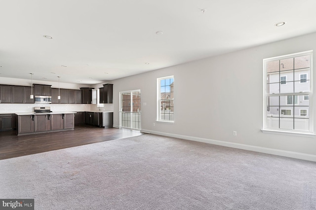 4507 Shakespeare Cir, White Plains, MD 20695 - unfurnished living room featuring recessed lighting, baseboards, and dark colored carpet