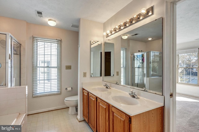 9208 Homestretch Ct, Laurel, MD 20723 - bathroom featuring baseboards, visible vents, a shower stall, and a sink