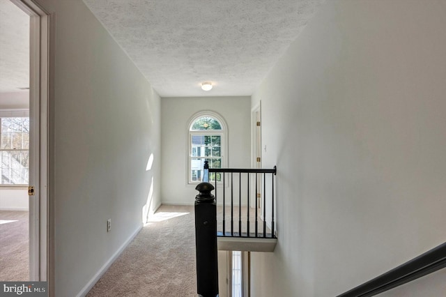 9208 Homestretch Ct, Laurel, MD 20723 - staircase featuring carpet floors, baseboards, and a textured ceiling
