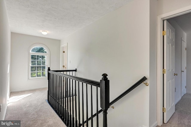 9208 Homestretch Ct, Laurel, MD 20723 - staircase featuring carpet floors, a textured ceiling, and baseboards
