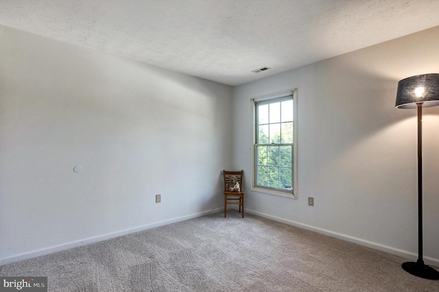 9208 Homestretch Ct, Laurel, MD 20723 - spare room with baseboards, carpet flooring, a textured ceiling, and visible vents