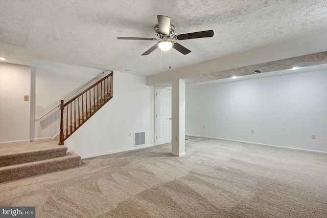 9208 Homestretch Ct, Laurel, MD 20723 - finished below grade area featuring visible vents, carpet floors, stairway, a textured ceiling, and a ceiling fan