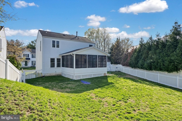 9208 Homestretch Ct, Laurel, MD 20723 - back of house featuring a lawn, a sunroom, and a fenced backyard