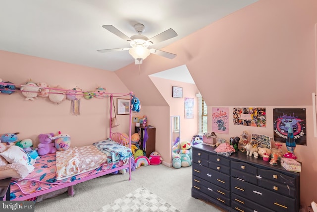 bedroom with ceiling fan, vaulted ceiling, and carpet