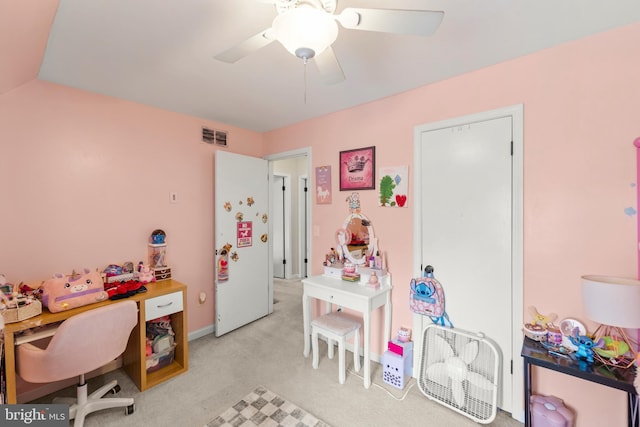 office with visible vents, ceiling fan, and light colored carpet