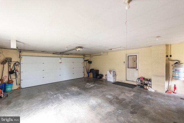 garage featuring a garage door opener and electric panel