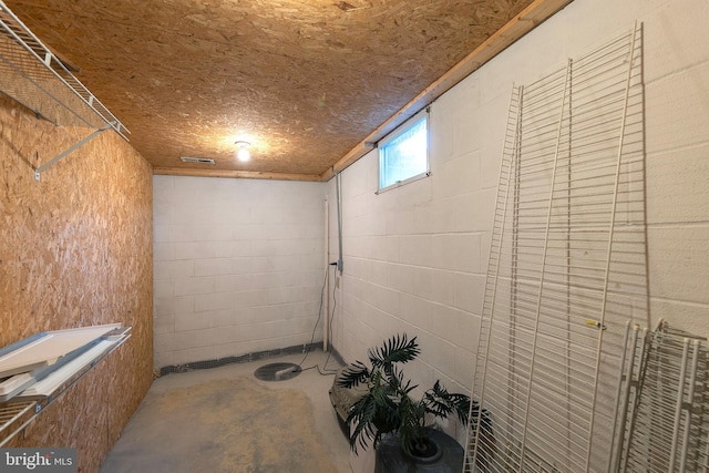 interior space with concrete block wall