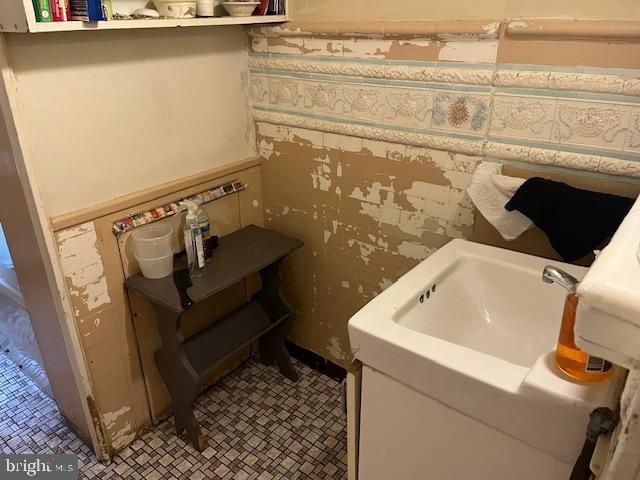 4900 N 11th St, Philadelphia, PA 19141 - bathroom featuring a sink and tile patterned floors