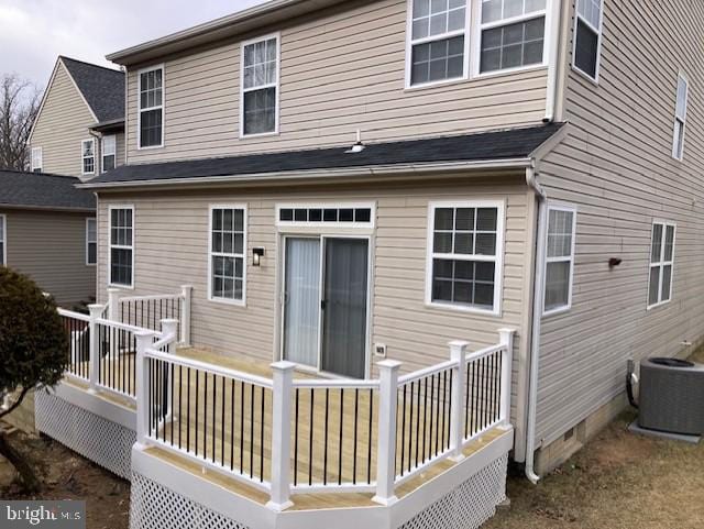 rear view of house with crawl space, central AC unit, and a deck