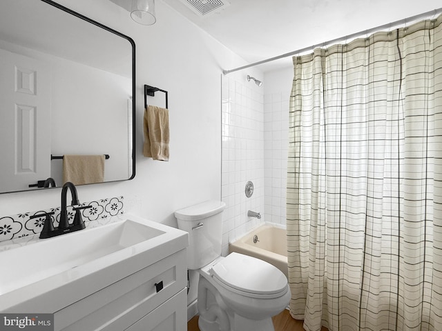 bathroom with vanity, shower / bath combination with curtain, toilet, and visible vents