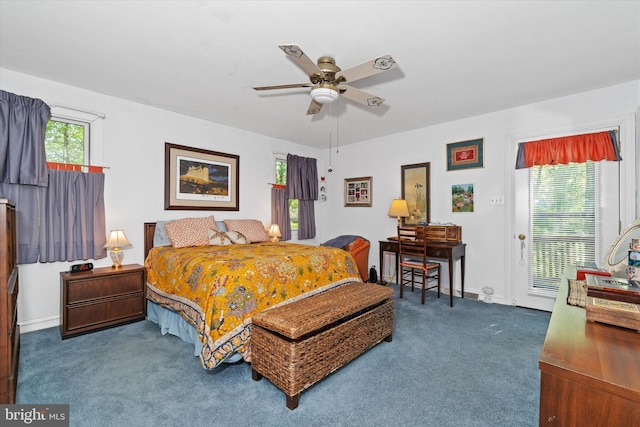 carpeted bedroom with baseboards and ceiling fan