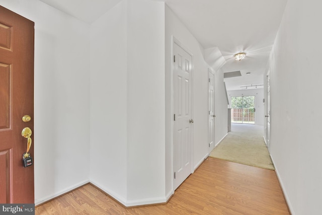 entrance foyer with light wood-style floors and baseboards