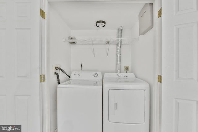 washroom with laundry area and washer and dryer