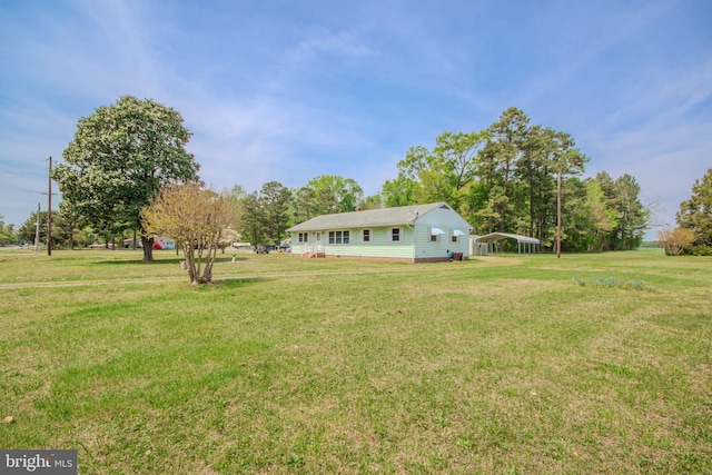 view of yard with a carport
