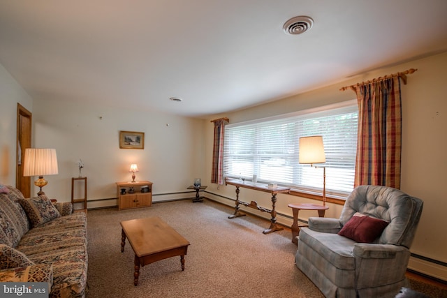 carpeted living area with baseboards, visible vents, baseboard heating, and a baseboard radiator
