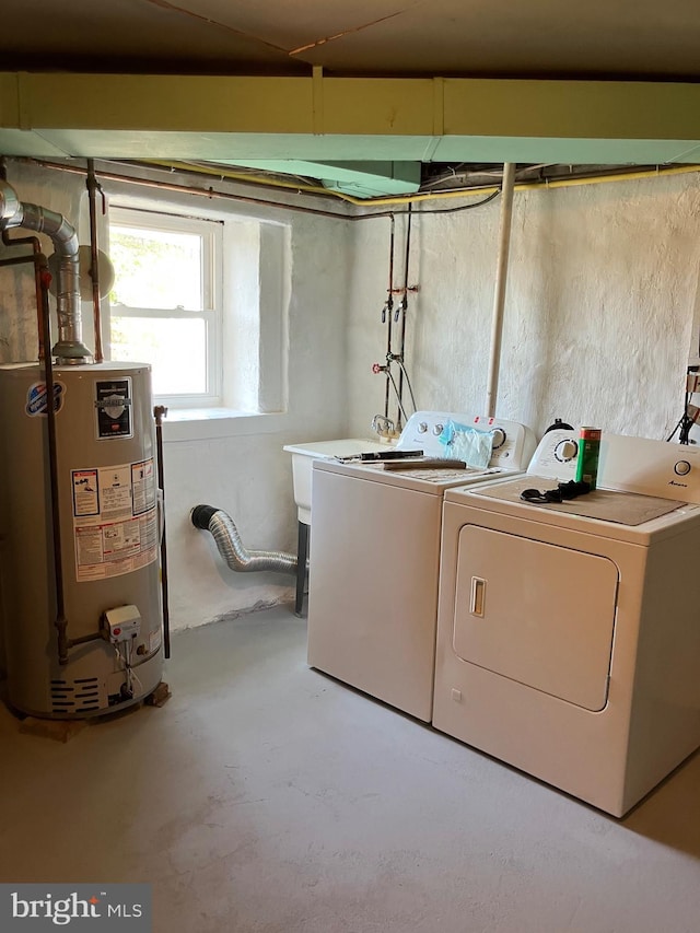laundry area featuring separate washer and dryer, laundry area, and water heater