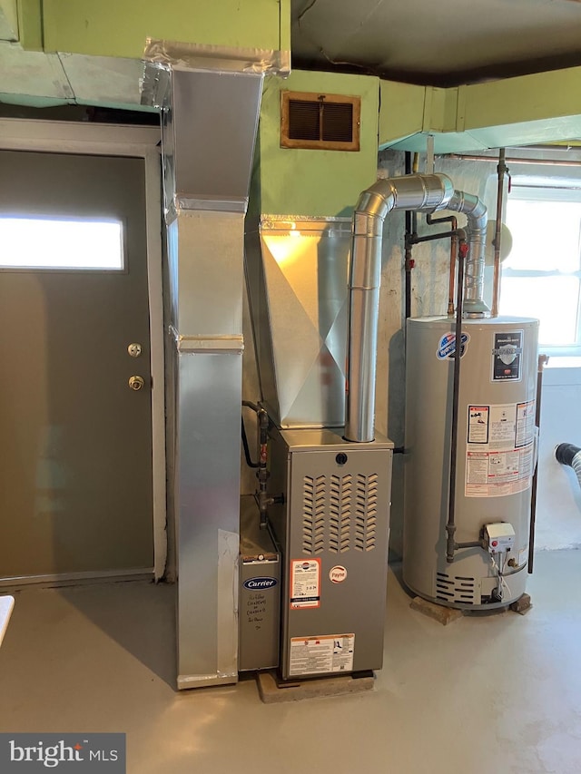 utility room with water heater