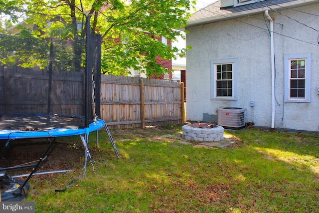 408 Prince George St, Cumberland, MD 21502 - view of yard featuring a trampoline, cooling unit, and an outdoor fire pit