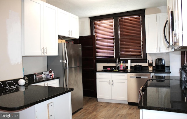 408 Prince George St, Cumberland, MD 21502 - kitchen featuring a sink, white cabinets, and appliances with stainless steel finishes