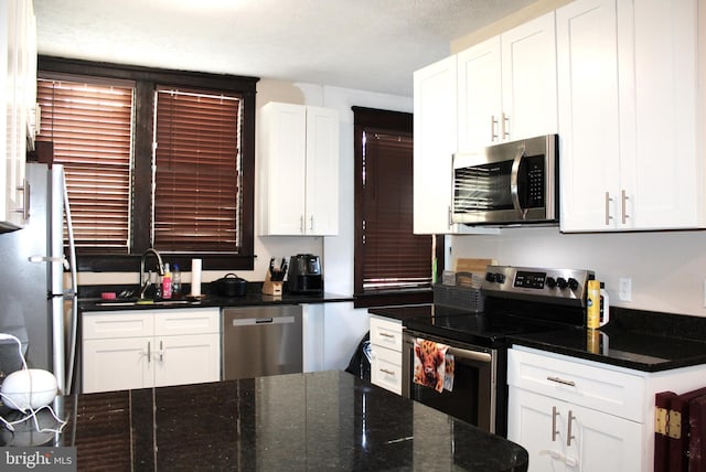 408 Prince George St, Cumberland, MD 21502 - kitchen featuring appliances with stainless steel finishes, a sink, and white cabinetry