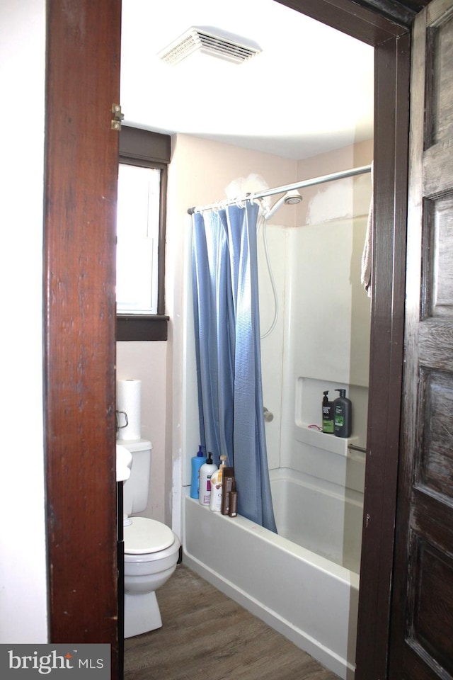 408 Prince George St, Cumberland, MD 21502 - full bath featuring toilet, shower / tub combo with curtain, and wood finished floors