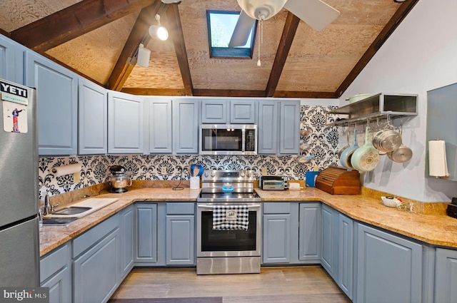 2436 Warm Springs Rd, Shenandoah Junction, WV 25442 - kitchen with stainless steel appliances, a skylight, light wood-style flooring, decorative backsplash, and wooden ceiling