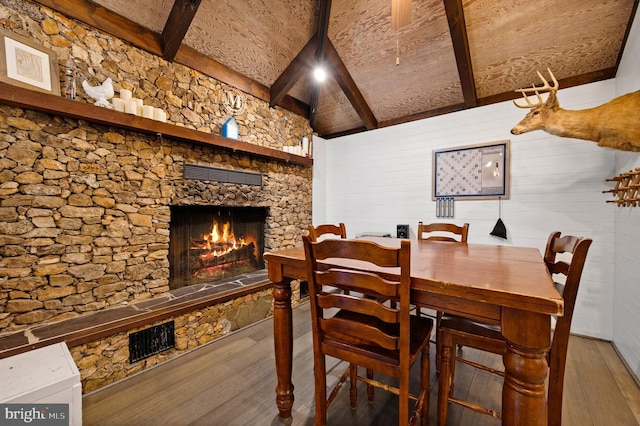 2436 Warm Springs Rd, Shenandoah Junction, WV 25442 - dining area featuring wood finished floors, a fireplace, and beam ceiling