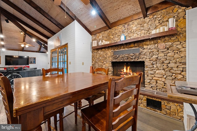 2436 Warm Springs Rd, Shenandoah Junction, WV 25442 - dining area with a stone fireplace, wood finished floors, and a ceiling fan