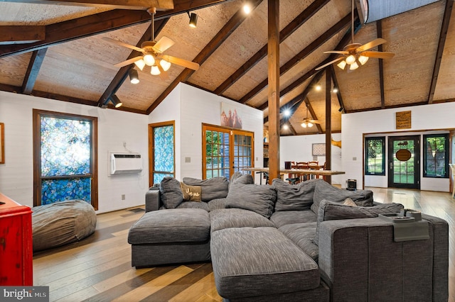 2436 Warm Springs Rd, Shenandoah Junction, WV 25442 - living area featuring a ceiling fan, hardwood / wood-style flooring, an AC wall unit, beamed ceiling, and high vaulted ceiling