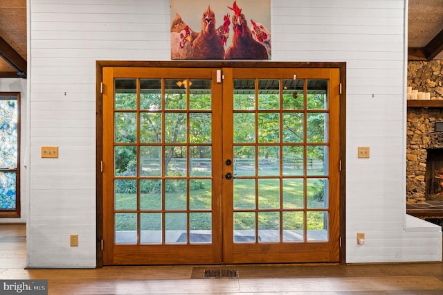 2436 Warm Springs Rd, Shenandoah Junction, WV 25442 - doorway to outside with wooden walls, wood finished floors, plenty of natural light, and french doors