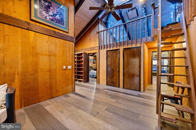 2436 Warm Springs Rd, Shenandoah Junction, WV 25442 - interior space with high vaulted ceiling, wooden walls, wood finished floors, a ceiling fan, and beamed ceiling