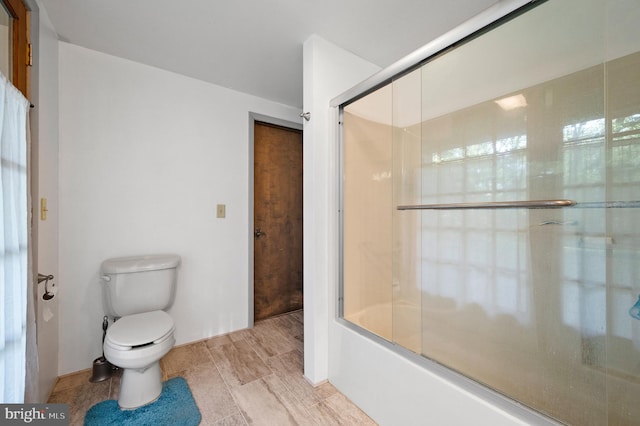 2436 Warm Springs Rd, Shenandoah Junction, WV 25442 - bathroom with toilet and shower / bath combination with glass door